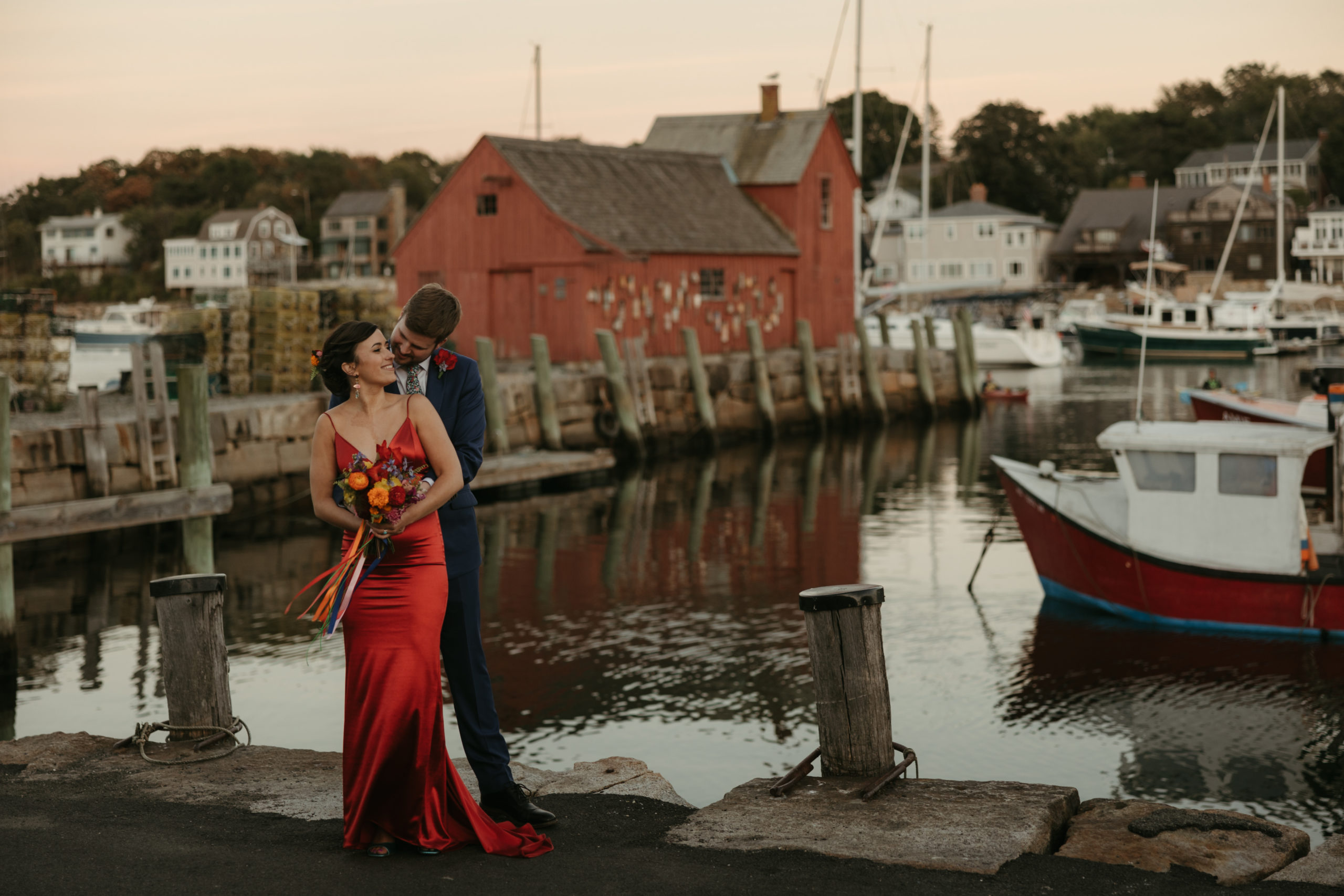 Boston couple in front of waterfront dock